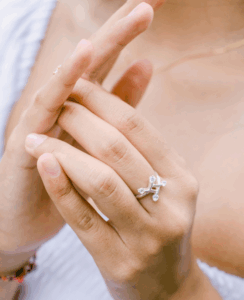 silver ring in finger