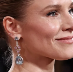 Kristen Bell on the red carpet wearing dazzling bold statement earrings crafted in 18k gold, set with aquamarine